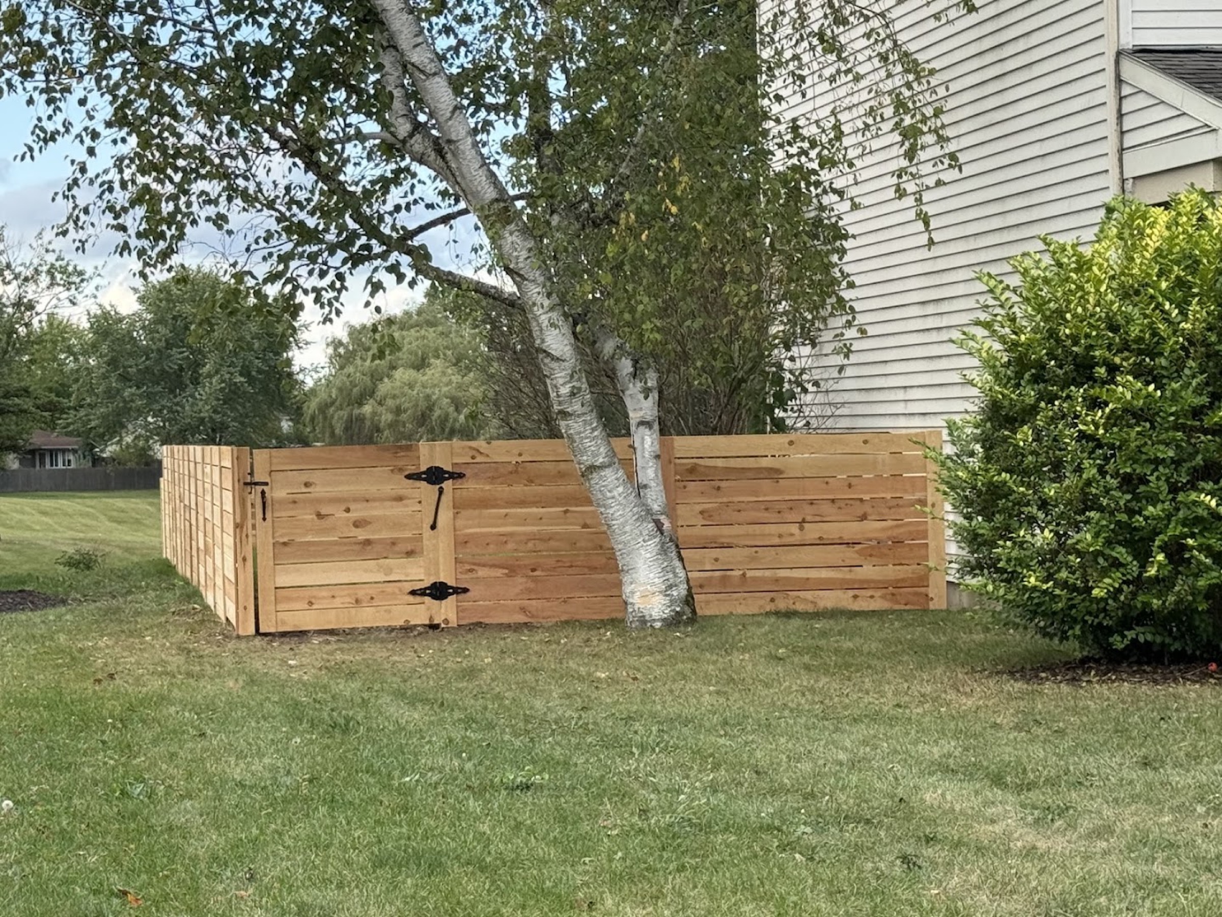 A newly built wood fence in a Fort Wayne yard