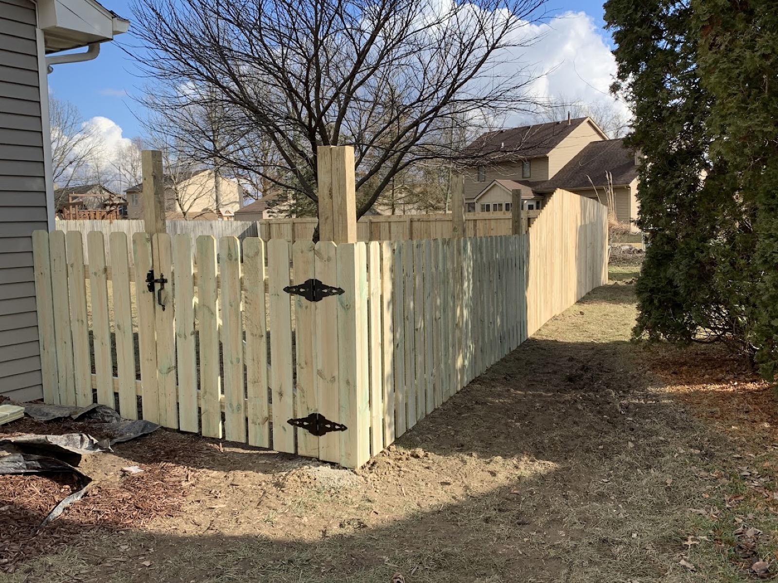 A custom gate built into a fence by Fort Wayne Fence