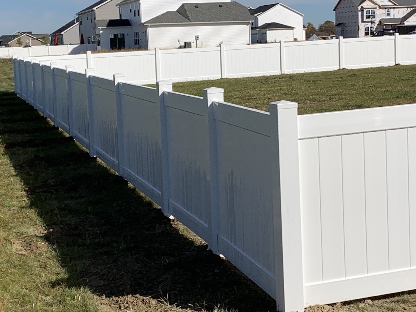 A white vinyl privacy fence installed at a Fort Wayne home