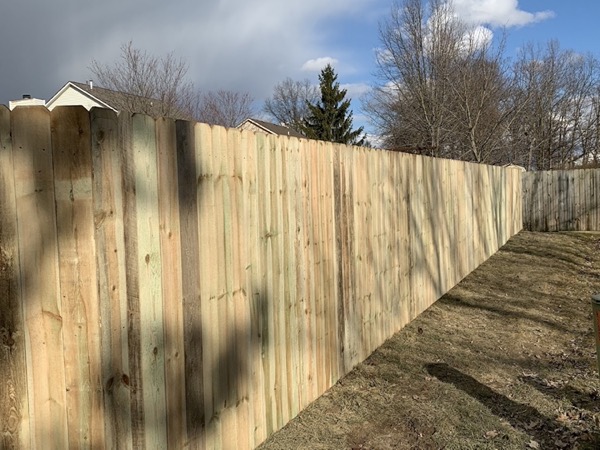 A wood privacy fence around a Fort Wayne property
