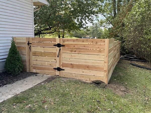 A wood privacy fence under construction