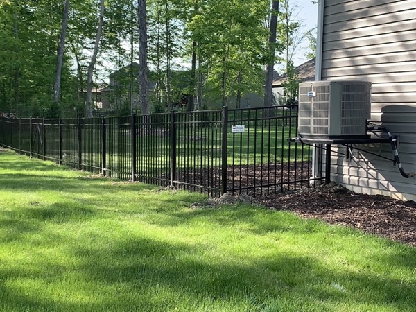 A wood privacy fence finished in a Fort Wayne yard